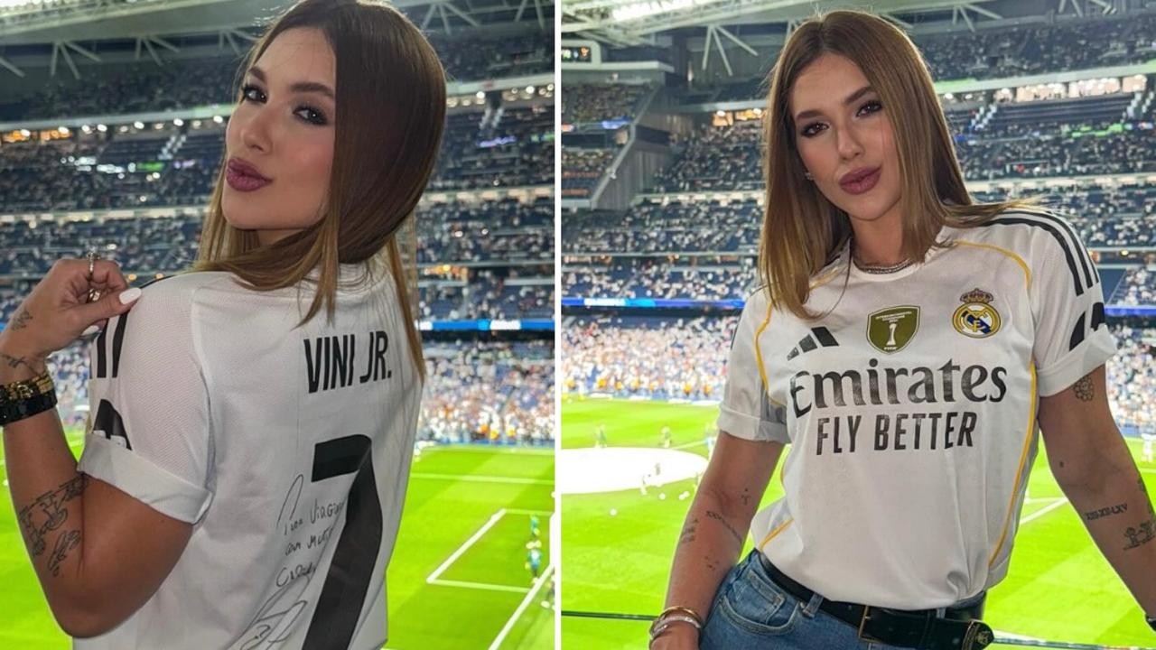 Virginia posa com camisa do Real Madrid com o nome de Vini Jr. atrás