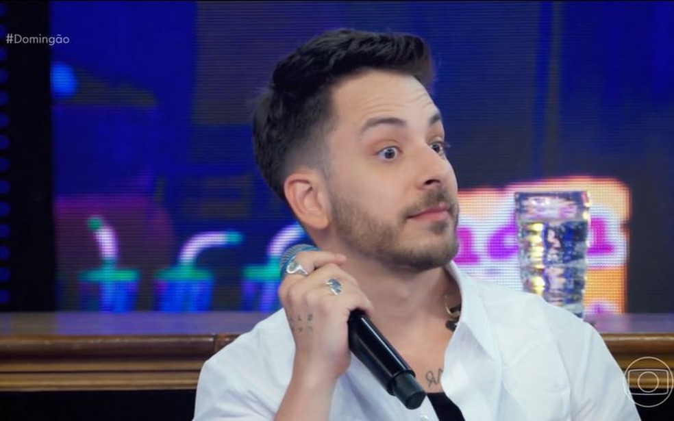 Junior ficou surpreso com recado de Sandy no Domingão — Foto: Globo
