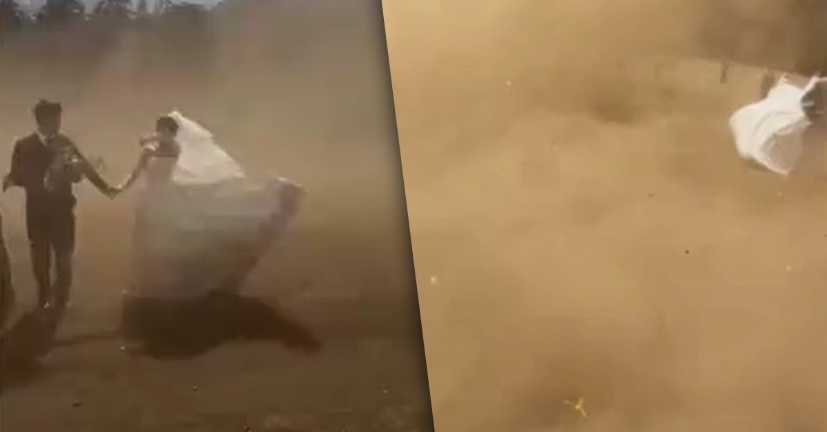 Noivos quase são levados por tempestade de areia durante ensaio de casamento na China e vídeo viraliza